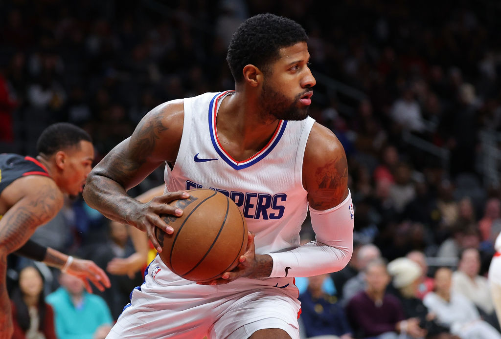 ATLANTA, GEORGIA - FEBRUARY 05: Paul George #13 of the LA Clippers grabs a rebound against the Atlanta Hawks during the first quarter at State Farm Arena on February 05, 2024 in Atlanta, Georgia. Philadelphia