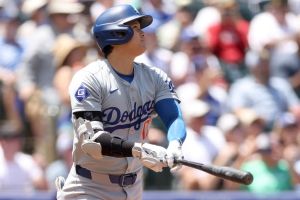 Shohei Ohtani #17 of the Los Angeles Dodgers hits a solo home run against the Colorado Rockies in the first inning at Coors Field on June 20, 2024 in Denver, Colorado.