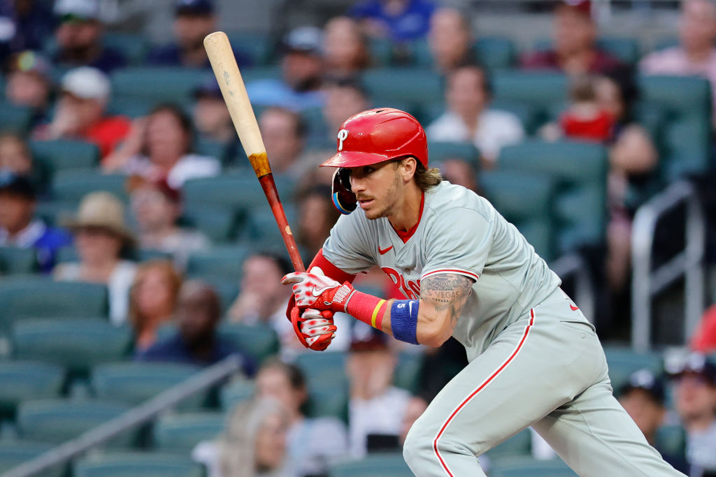 ATLANTA, GEORGIA - JULY 05: Bryson Stott #5 of the Philadelphia Phillies hits an RBI single during the fourth inning Atlanta Braves at Truist Park on July 05, 2024 in Atlanta, Georgia.