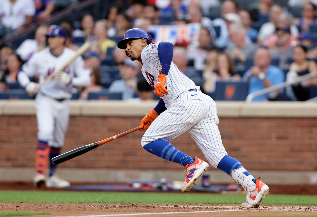 NEW YORK, NEW YORK - JULY 09:  Francisco Lindor #12 of the New York Mets follows through on his second inning RBI single against the Washington Nationals at Citi Field on July 09, 2024 in New York City.