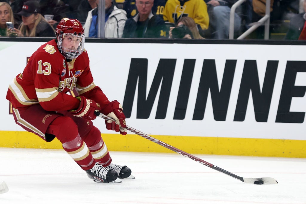 Massimo Rizzo #13 of the Denver Pioneers skates during overtime of the Frozen Four semifinal game between the Michigan Wolverines and Denver Pioneers at TD Garden on April 07, 2022 in Boston, Massachusetts. The Pioneers defeat the Wolverines 3-2.