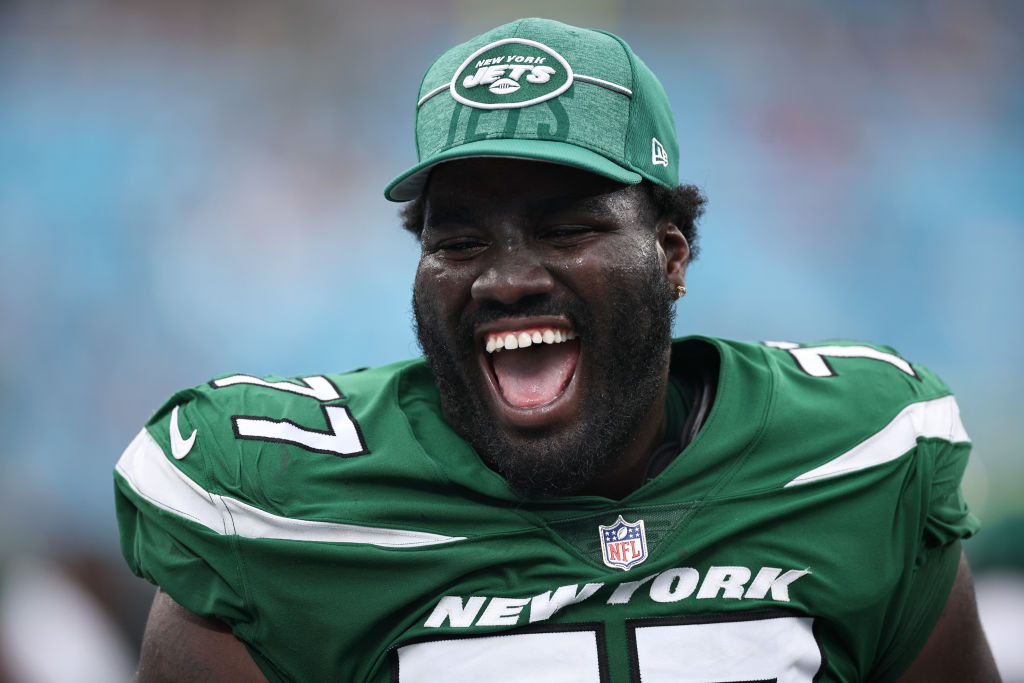 CHARLOTTE, NORTH CAROLINA - AUGUST 12: Mekhi Becton #77 of the New York Jets reacts during the fourth quarter of the game against the Carolina Panthers at Bank of America Stadium on August 12, 2023 in Charlotte, North Carolina. 