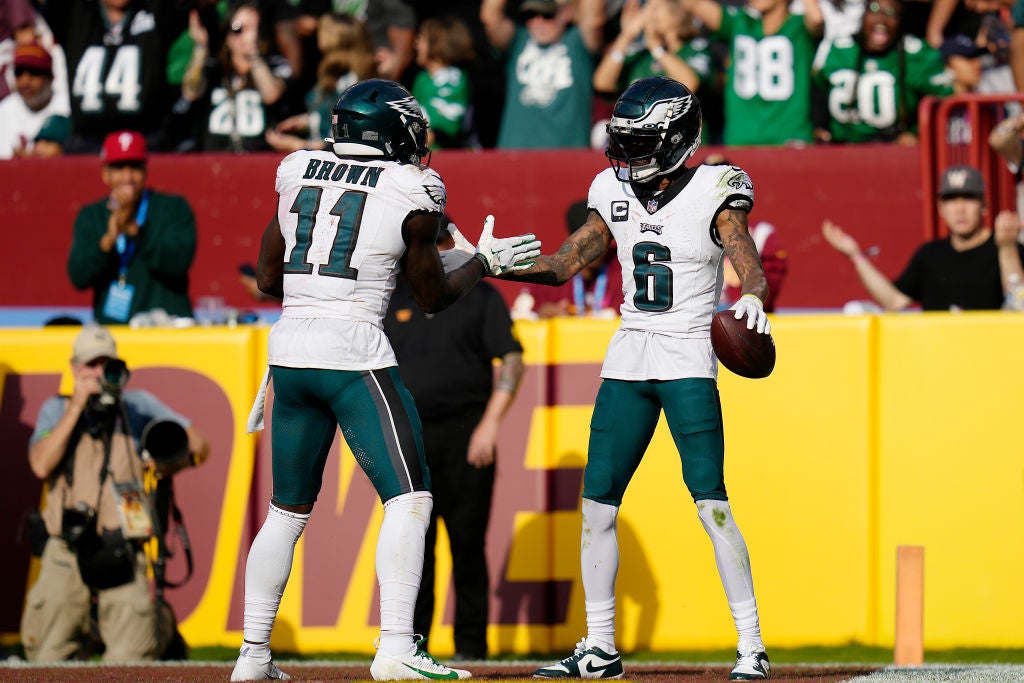 LANDOVER, MARYLAND - OCTOBER 29: DeVonta Smith #6 celebrates a fourth quarter touchdown with A.J. Brown #11 of the Philadelphia Eagles during a game against the Washington Commanders at FedExField on October 29, 2023 in Landover, Maryland.