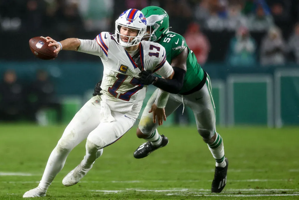 PHILADELPHIA, PENNSYLVANIA - NOVEMBER 26: Zach Cunningham #52 of the Philadelphia Eagles attempts to tackle Josh Allen #17 of the Buffalo Bills during the second quarter at Lincoln Financial Field on November 26, 2023 in Philadelphia, Pennsylvania. 