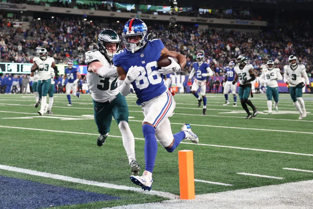 EAST RUTHERFORD, NEW JERSEY - JANUARY 07: Darius Slayton #86 of the New York Giants scores a touchdown while defended by Reed Blankenship #32 of the Philadelphia Eagles during the second quarter at MetLife Stadium on January 07, 2024 in East Rutherford, New Jersey.