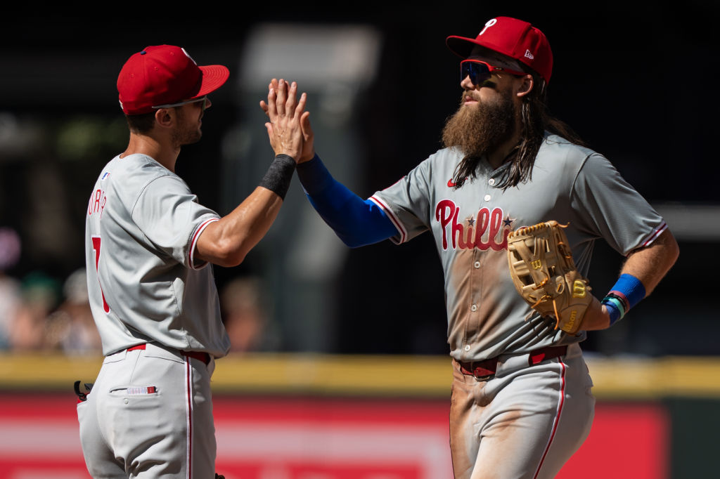 Trea Turner #7 and Brandon Marsh #16 of the Philadelphia Phillies celebrate after a game against the Seattle Mariners at T-Mobile Park on August 4, 2024 in Seattle, Washington. The Phillies won 6-0.