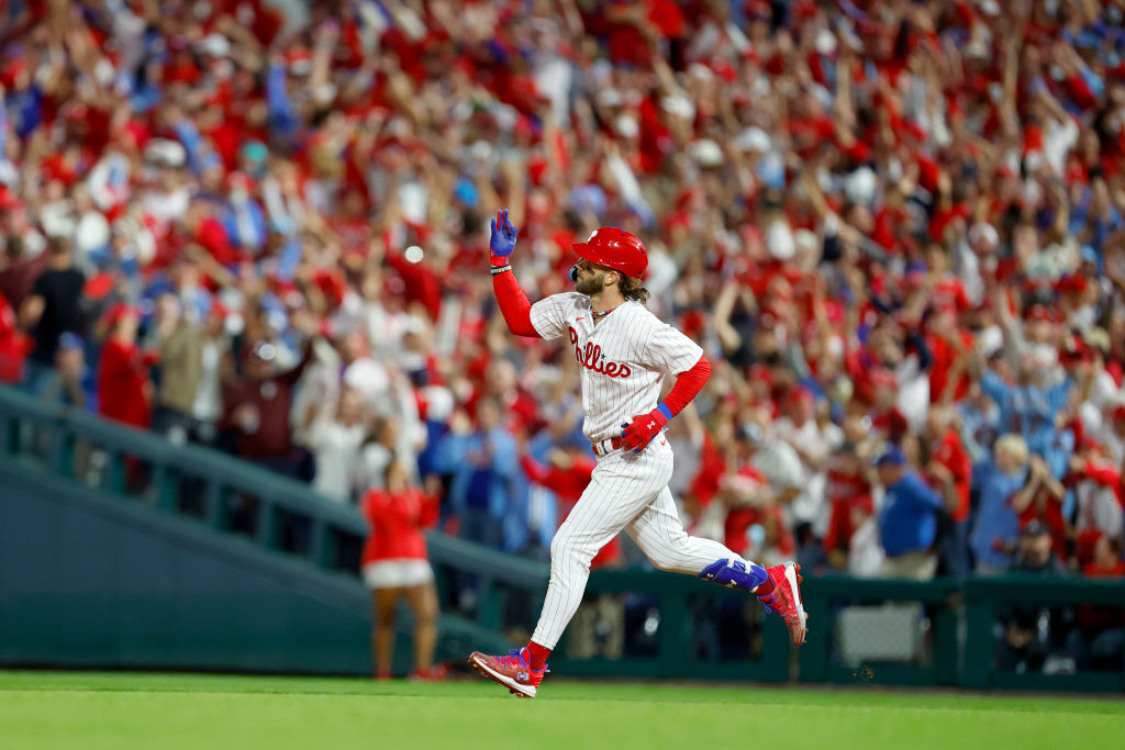 Bryce Harper (Atta Boy) #3 of the Philadelphia Phillies rounds the bases after hitting a solo home run against Brad Hand #45 of the Atlanta Braves during the fifth inning in Game Three of the Division Series at Citizens Bank Park on October 11, 2023 in Philadelphia, Pennsylvania.