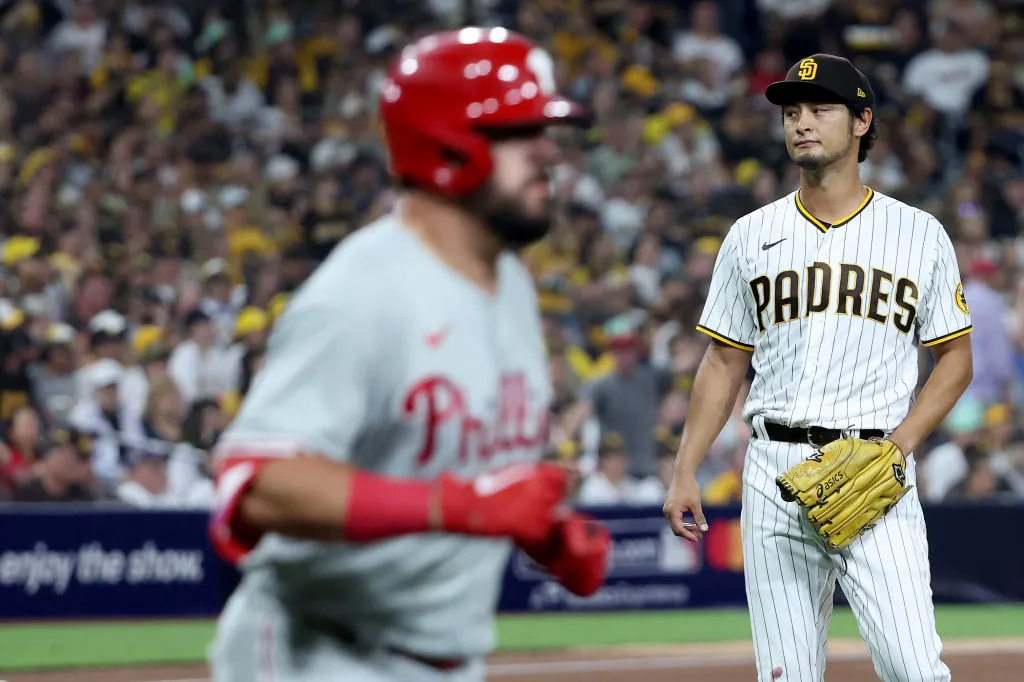 Yu Darvish #11 of the San Diego Padres reacts after giving up a home run to Kyle Schwarber #12 of the Philadelphia Phillies in the sixth inning against the Philadelphia Phillies in game one of the National League Championship Series at PETCO Park on October 18, 2022 in San Diego, California.