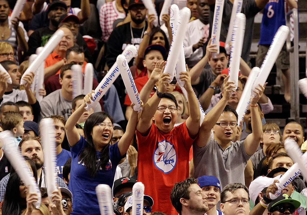 Philadelphia 76ers fans cheer during the second half of their 86-82 win over the Miami Heat in Game Four of the Eastern Conference Quarterfinals in the 2011 NBA Playoffs at Wells Fargo Center on April 24, 2011 in Philadelphia, Pennsylvania. NOTE TO USER: User expressly acknowledges and agrees that, by downloading and/or using this Photograph, User is consenting to the terms and conditions of the Getty Images License Agreement.