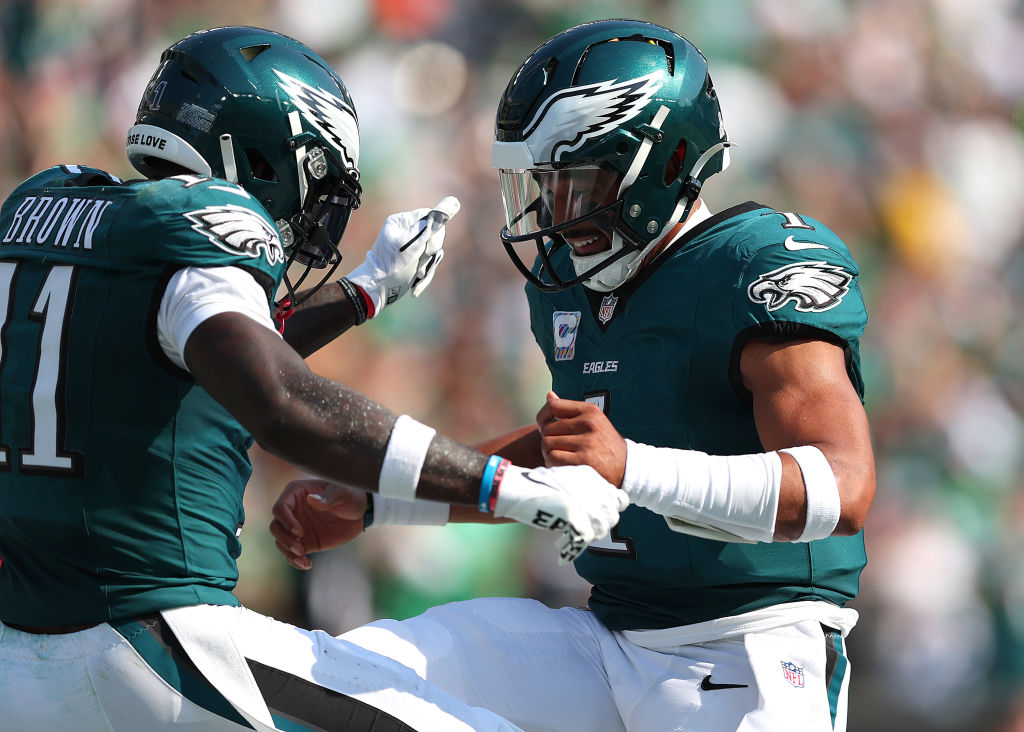 PHILADELPHIA, PENNSYLVANIA - OCTOBER 13: A.J. Brown #11 of the Philadelphia Eagles celebrates scoring a touchdown thrown by Jalen Hurts #1 during the second quarter against the Cleveland Browns at Lincoln Financial Field on October 13, 2024 in Philadelphia, Pennsylvania.