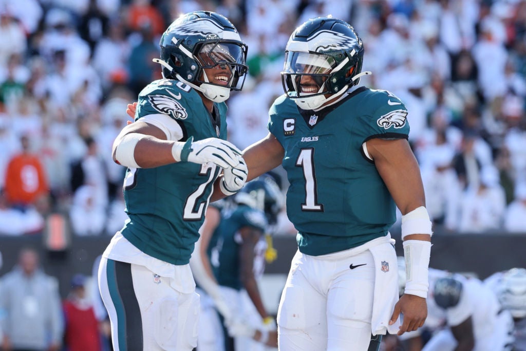 CINCINNATI, OHIO - OCTOBER 27: Saquon Barkley #26 and Jalen Hurts #1 of the Philadelphia Eagles celebrate a touchdown during the fourth quarter against the Cincinnati Bengals at Paycor Stadium on October 27, 2024 in Cincinnati, Ohio.