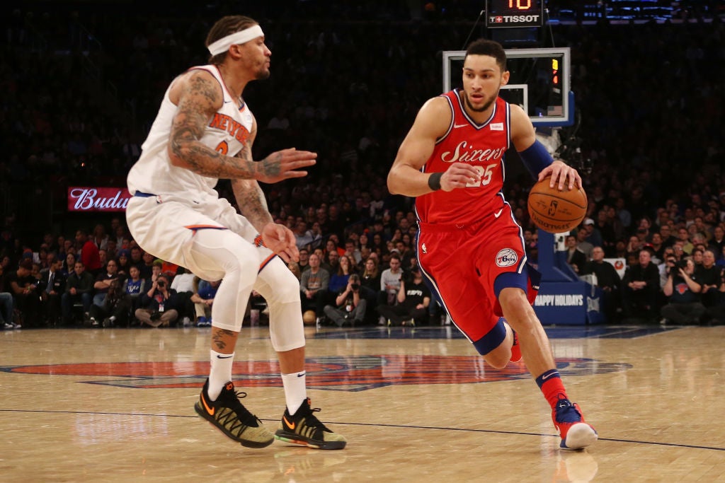 Ben Simmons #25 of the Philadelphia 76ers dribbles the ball aganst Michael Beasley #8 of the New York Knicks at Madison Square Garden on December 25, 2017 in New York City.