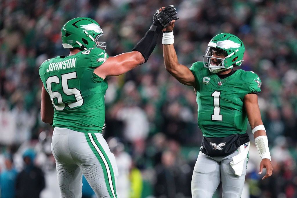 PHILADELPHIA, PENNSYLVANIA - NOVEMBER 03: Lane Johnson #65 and Jalen Hurts #1 of the Philadelphia Eagles celebrate after their team's rushing touchdown in the second quarter of a game against the Jacksonville Jaguars at Lincoln Financial Field on November 03, 2024 in Philadelphia, Pennsylvania. 