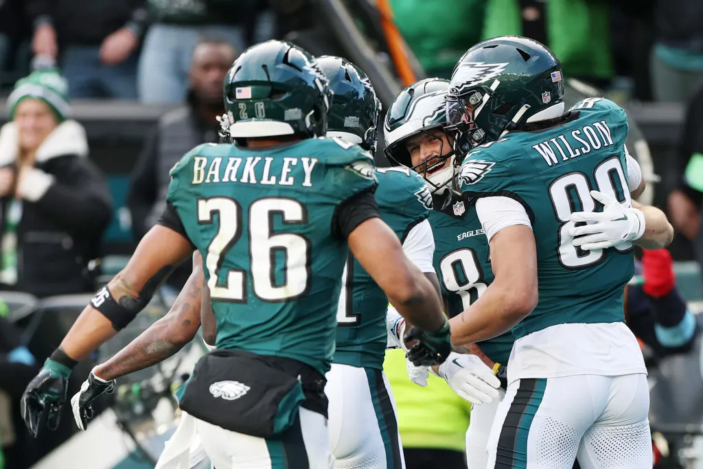 PHILADELPHIA, PENNSYLVANIA - DECEMBER 08: Grant Calcaterra #81 of the Philadelphia Eagles celebrates with teammates after catching a touchdown pass in the fourth quarter of a game against the Carolina Panthers at Lincoln Financial Field on December 08, 2024 in Philadelphia, Pennsylvania.