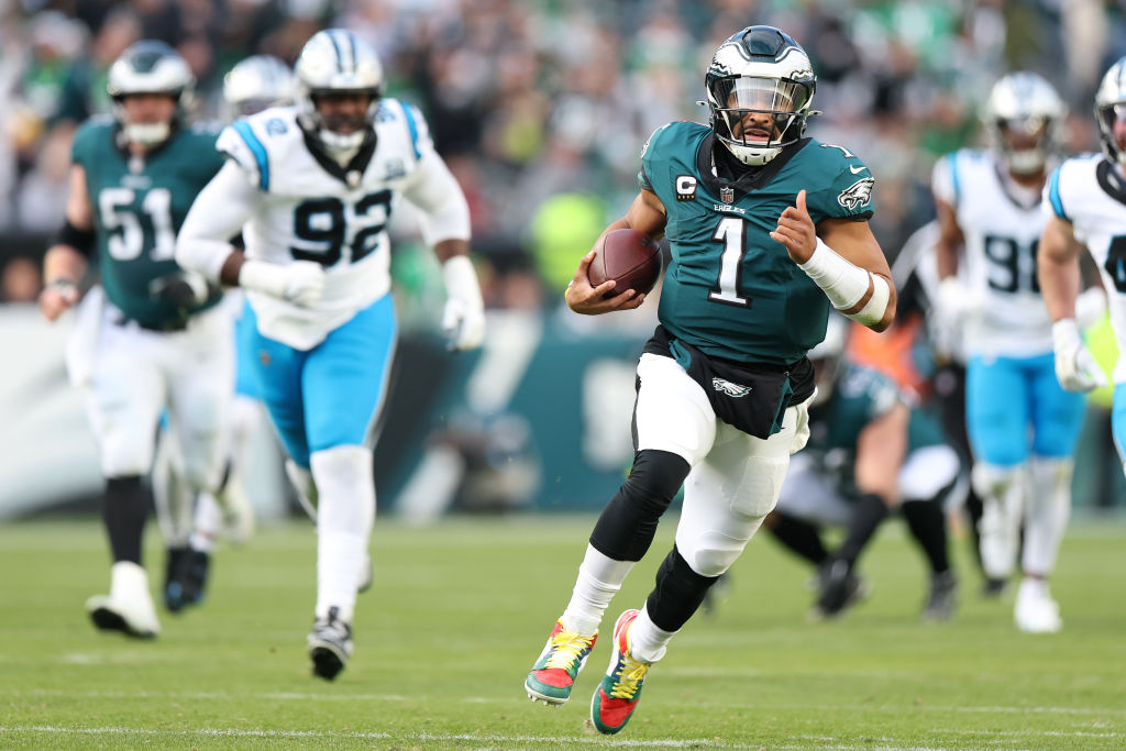 Jalen Hurts #1 of the Philadelphia Eagles runs the ball up the field in the fourth quarter of a game against the Carolina Panthers at Lincoln Financial Field on December 08, 2024 in Philadelphia, Pennsylvania.