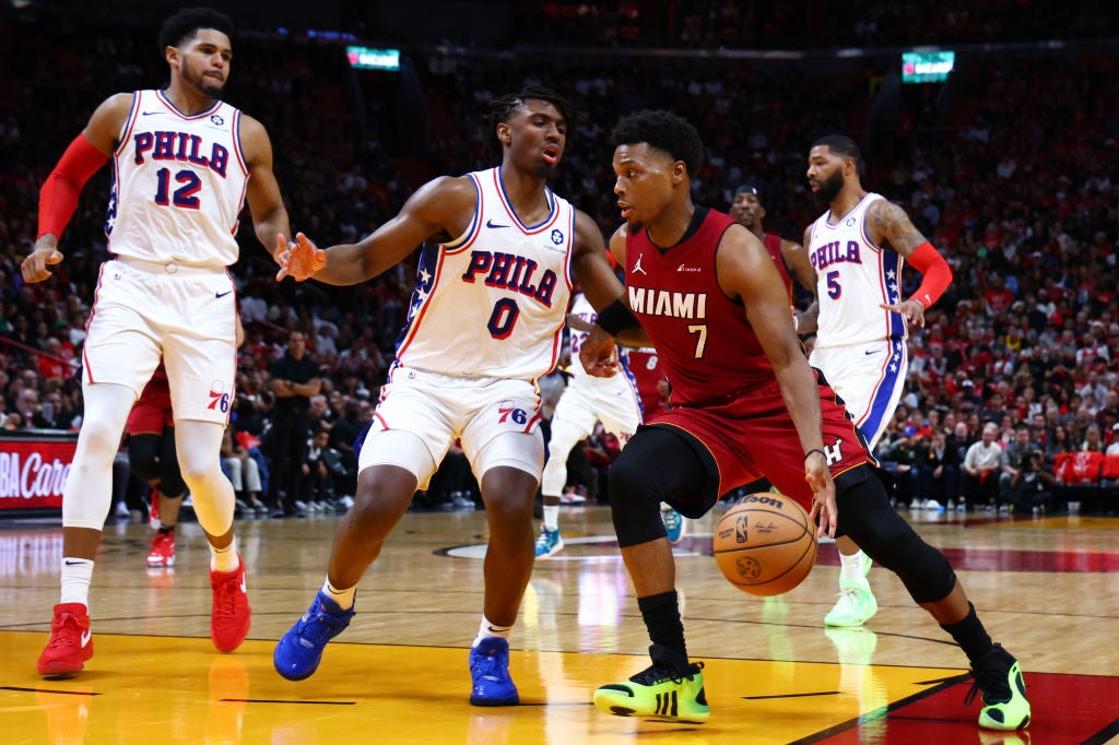 Kyle Lowry #7 of the Miami Heat drives against Tyrese Maxey #0 of the Philadelphia 76ers during the third quarter at Kaseya Center on December 25, 2023 in Miami, Florida. NOTE TO USER: User expressly acknowledges and agrees that, by downloading and or using this photograph, User is consenting to the terms and conditions of the Getty Images License Agreement.