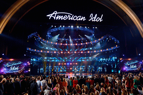 Host Ryan Seacrest (L) and Brian Dunkleman speak onstage during FOX's "American Idol" Finale For The Farewell Season 