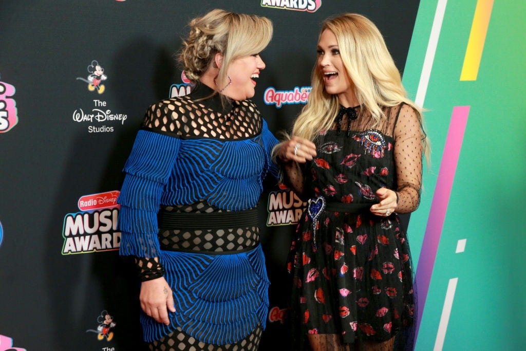 Kelly Clarkson and Carrie Undewood attend the 2018 Radio Disney Music Awards 